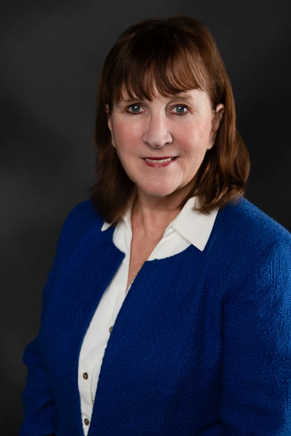 Leanne Salter, smiling, in a blue jacket